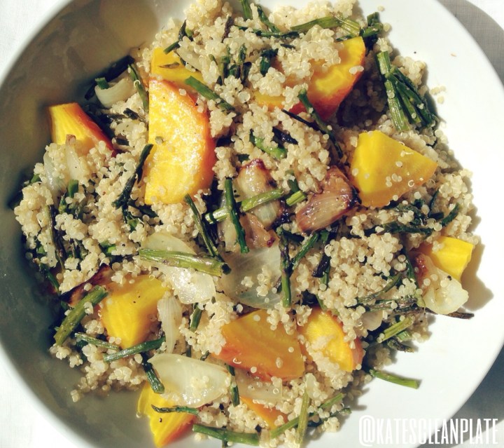 Warm quinoa salad with roasted asparagus, onion and golden beets