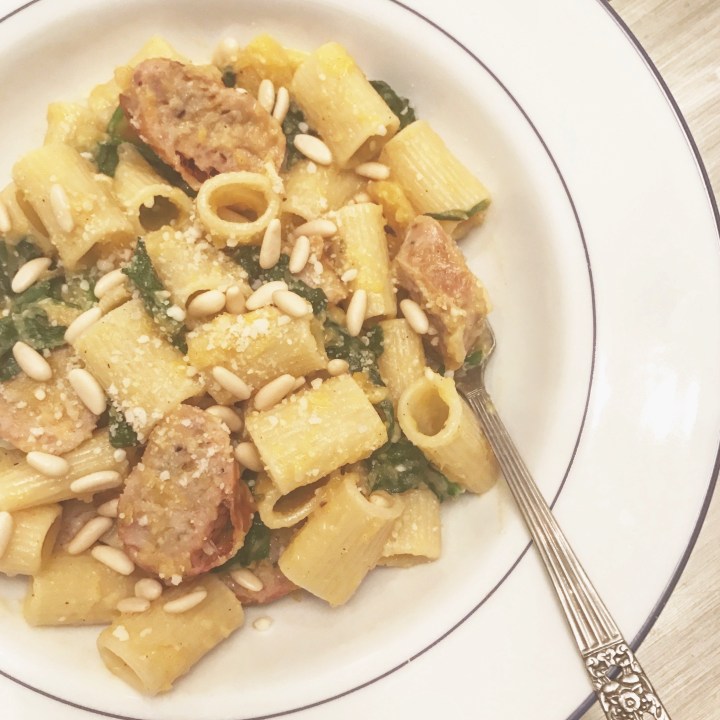 Butternut squash sauce over pasta, with sausage, spinach and pine&nbsp;nuts!