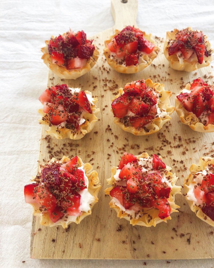 Strawberries and cream phyllo cups with shaved milk chocolate!